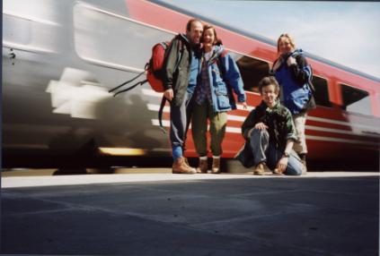 A train rushes behind us at the end of the journey